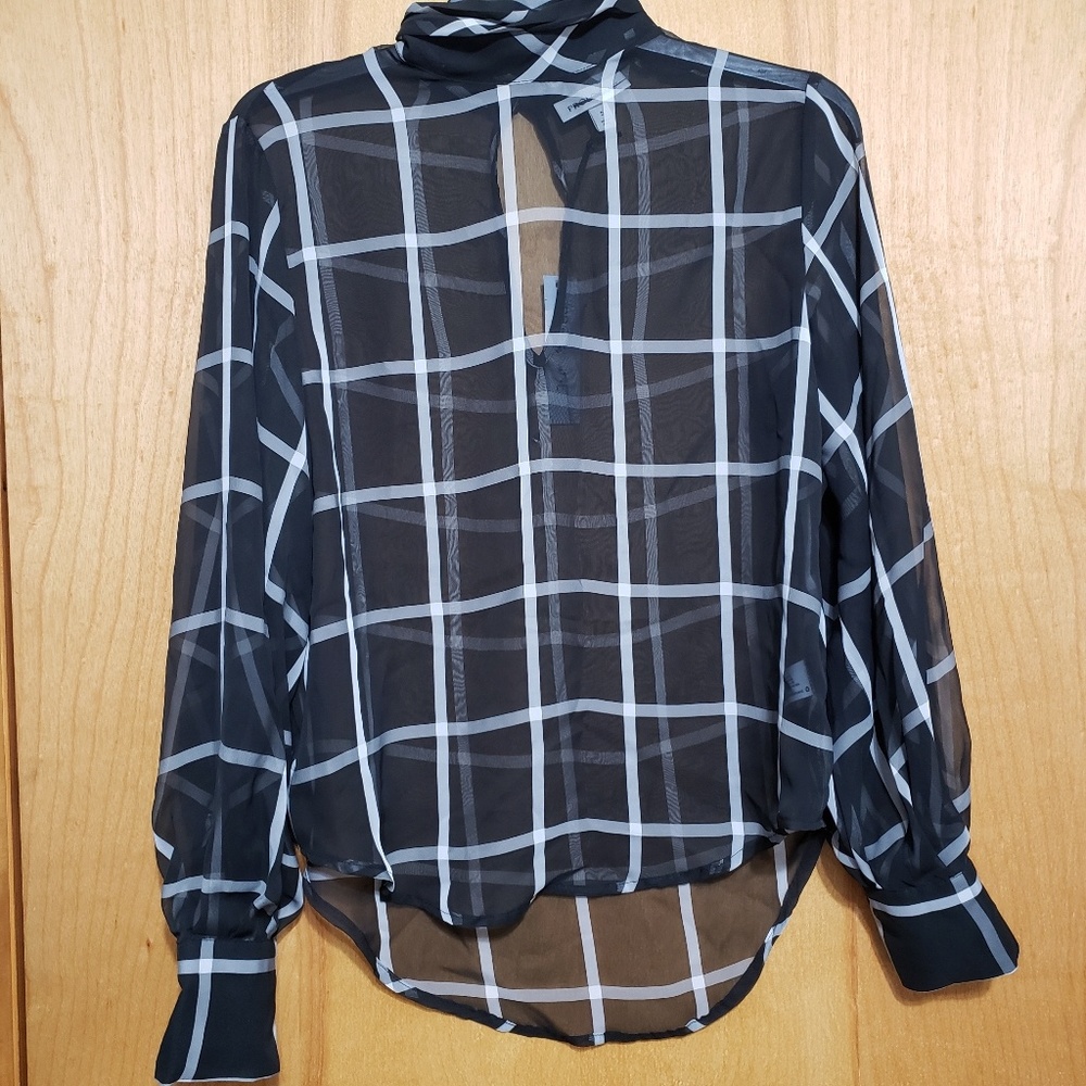 See through black and white plad top.